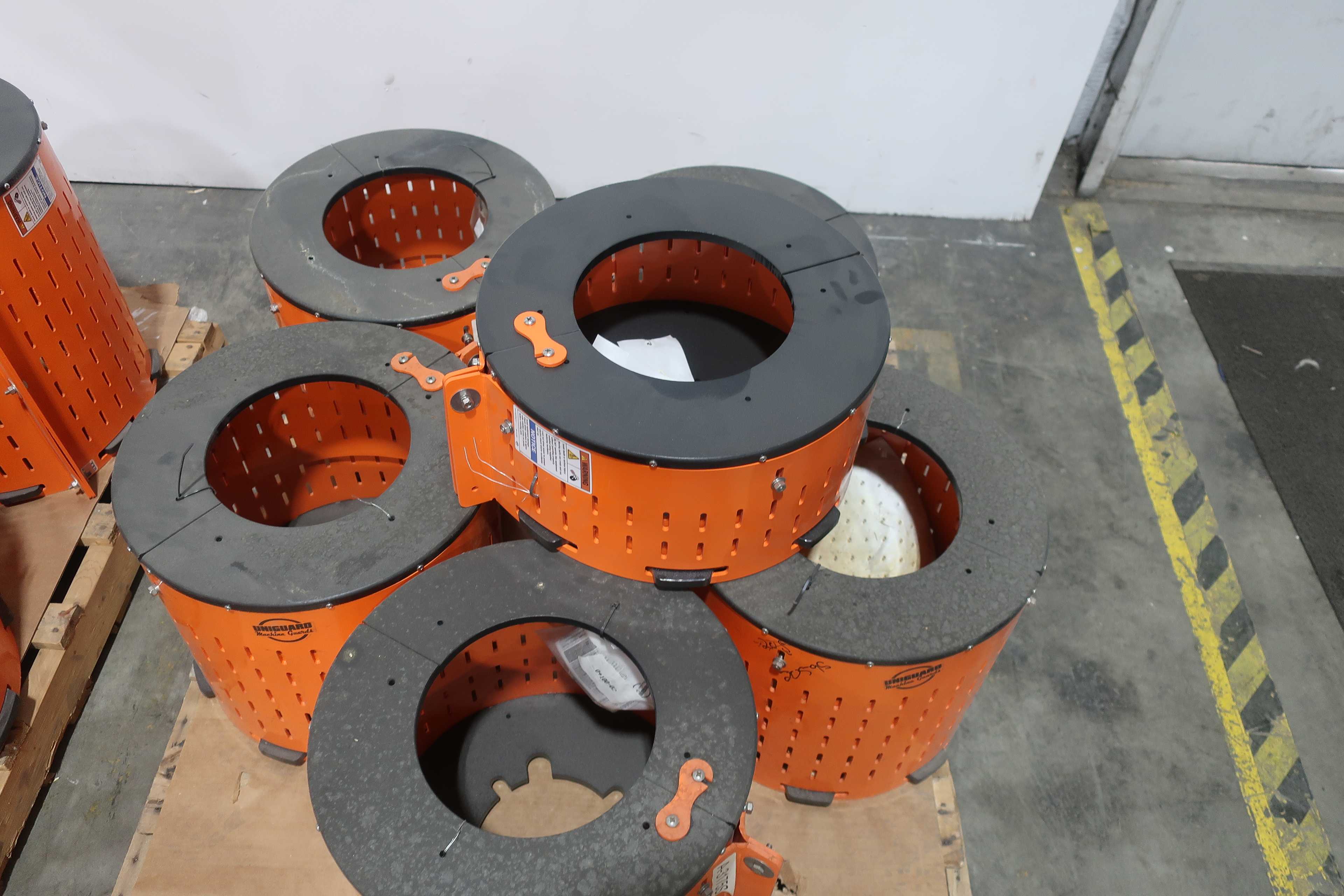 SKU 1740661 - 3 PALLETS OF ASSORTED SAFTEY ORANGE UNIGUARD BARREL GUARD ADAPTER PLATES - PUMP REPLACEMENT PARTS