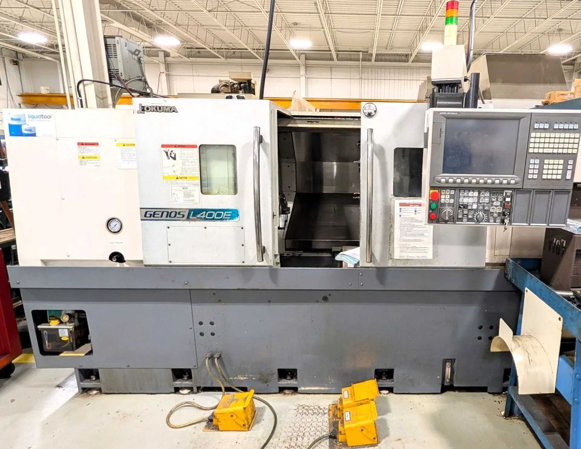2012 OKUMA GENOS L400E CNC TURNING CENTER, 3000 RPM, 10-INCH CHUCK, 12-POS TURRET, OSP-P200L-R - CNC LATHES