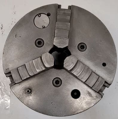 CUSHMAN 10IN, 3 JAW LATHE CHUCK WITH 2IN CENTER HOLE (10” OVERALL DIAMETER) - MACHINE TOOLING