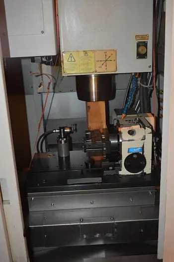 BRIDGEPORT/HARDINGE GX-300 4-AXIS VMC, FANUC, 20HP, 7083 RPM, CT40, TSUDAKOMA RNA-160L - VERTICAL MACHINING CENTERS