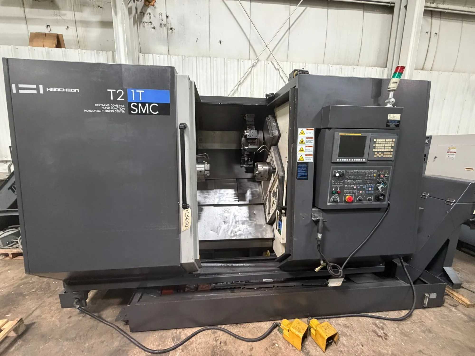 2013 HWACHEON T2-1T SMC CNC LATHE, TWIN SPINDLE, 5,000 RPM, 20 HP, 12 TURRET, FANUC 0I-TD - CNC LATHES
