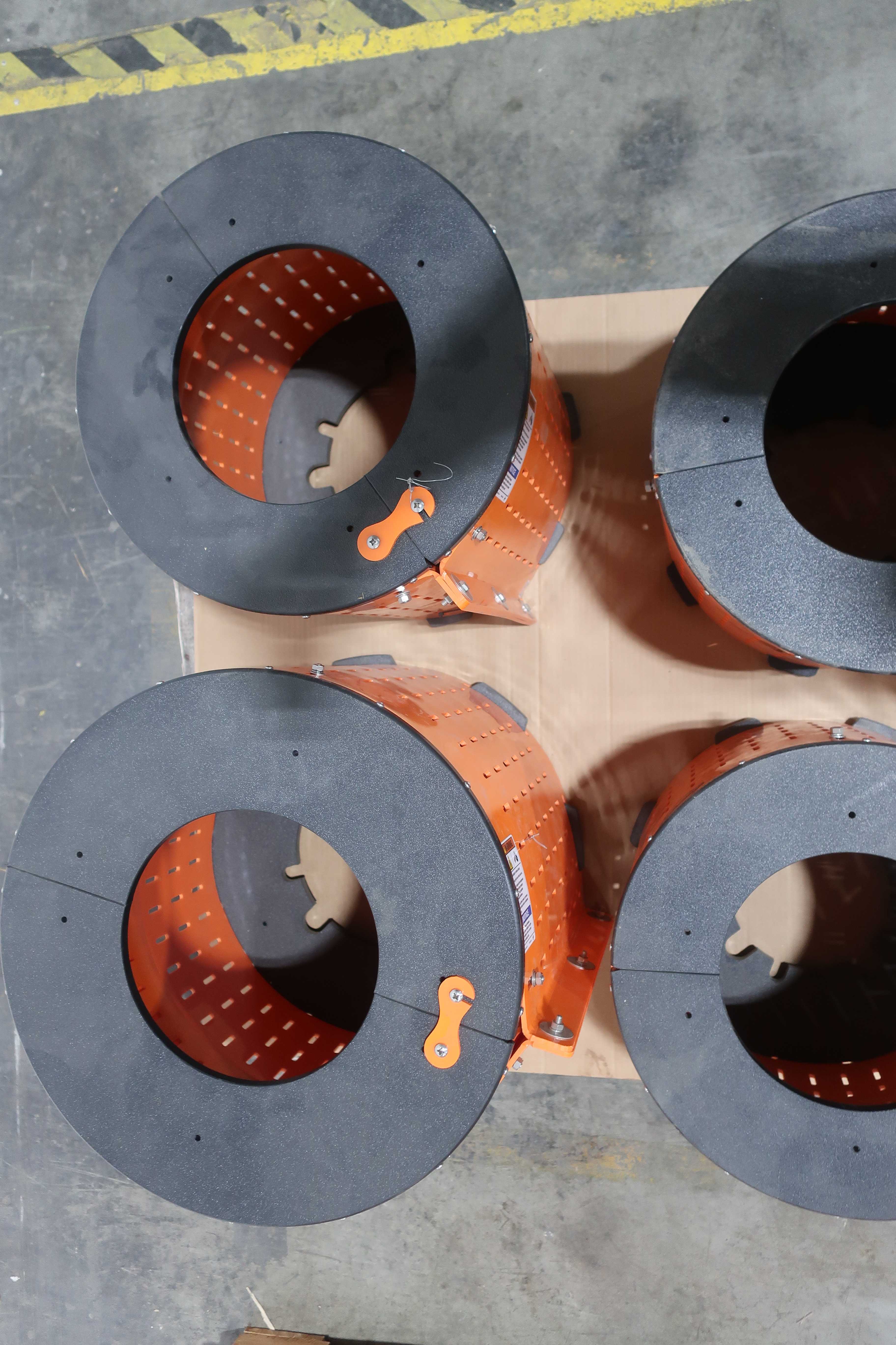 SKU 1740679 - 3 PALLETS OF ASSORTED SAFTEY ORANGE UNIGUARD BARREL GUARD ADAPTER PLATES - PUMP REPLACEMENT PARTS