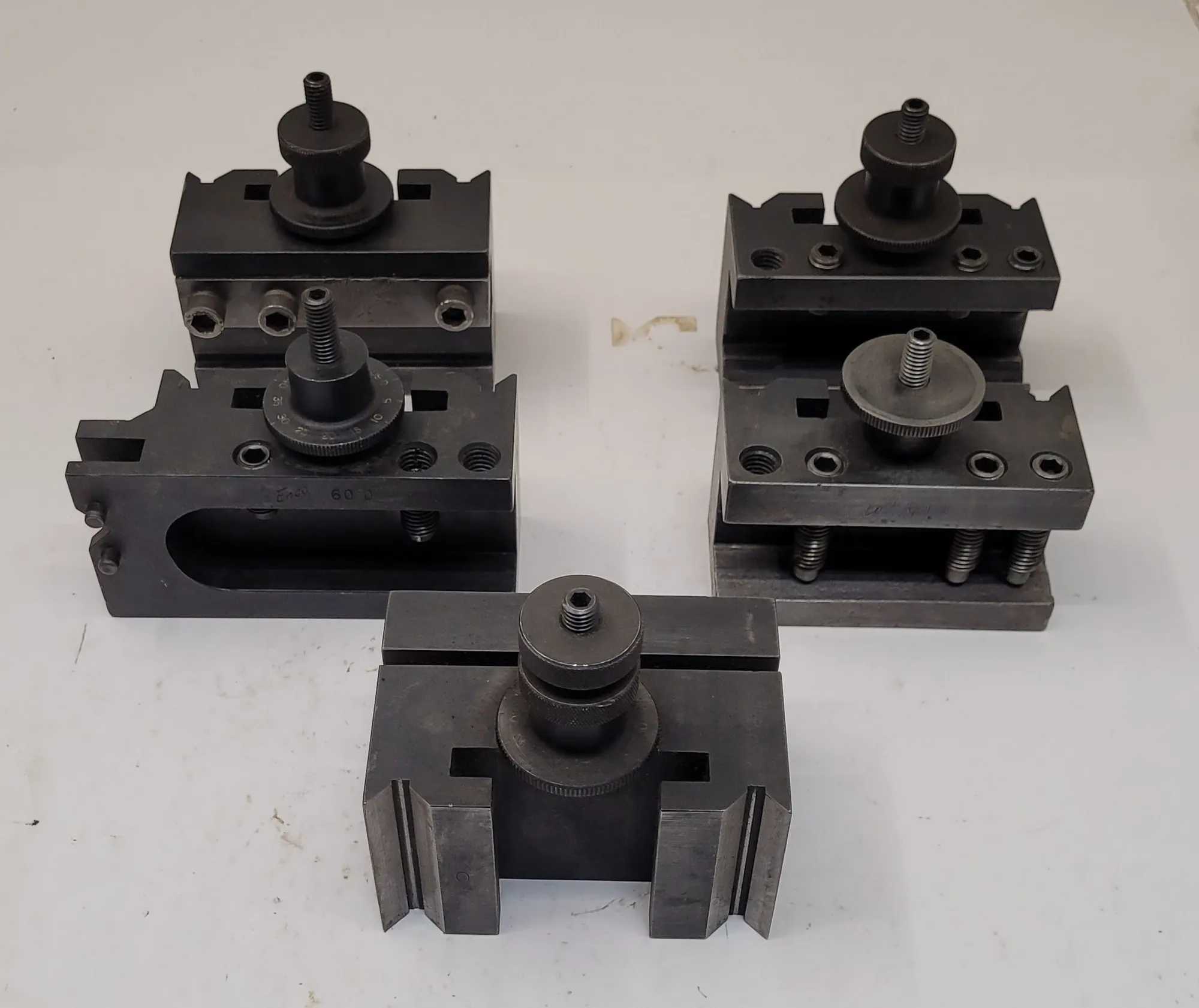 EMCO TOOL POST HOLDERS SET OF 5 - INCLUDES 2X 60B, 1X 60E, 1X 60D, AND 1X 1.5IN BORING HOLE - MACHINE TOOLING