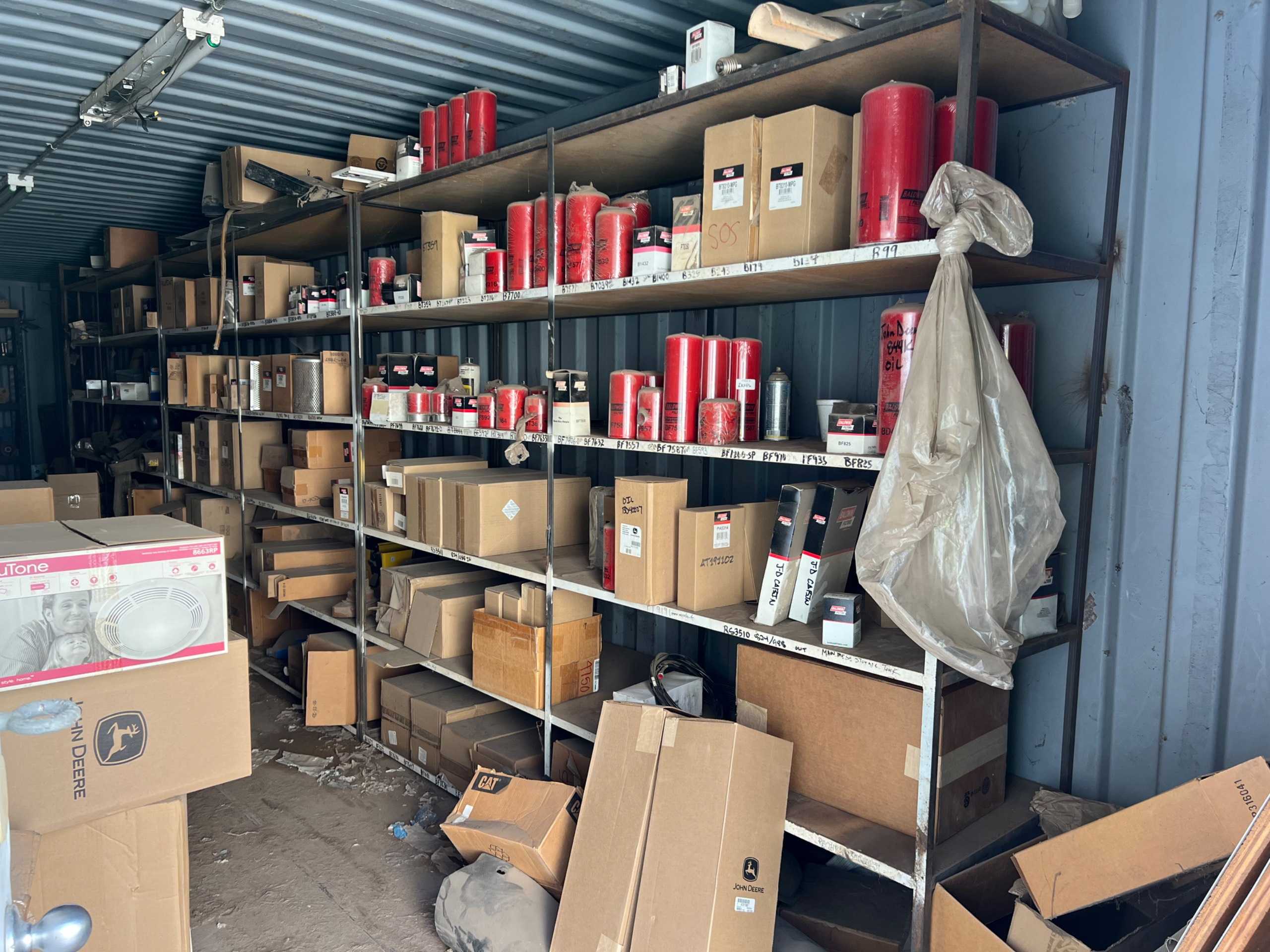 CONTAINER OF HEAVY EQUIPMENT PARTS - INDUSTRIAL PARTS
