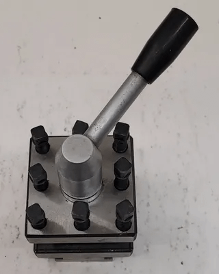 4-WAY LATHE TOOL POST H: 6-3/4” OVERALL W: 3.15IN L: 3.15IN GAP: 1-1/4IN BASE: .72IN - MACHINE TOOLING