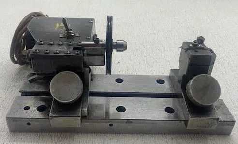 HARIG OD TURN FIXTURE, 7 IN DISTANCE BETWEEN CENTERS, 6 IN SWING, 115V, 180/360 RPM WHEEL - MACHINE TOOLING
