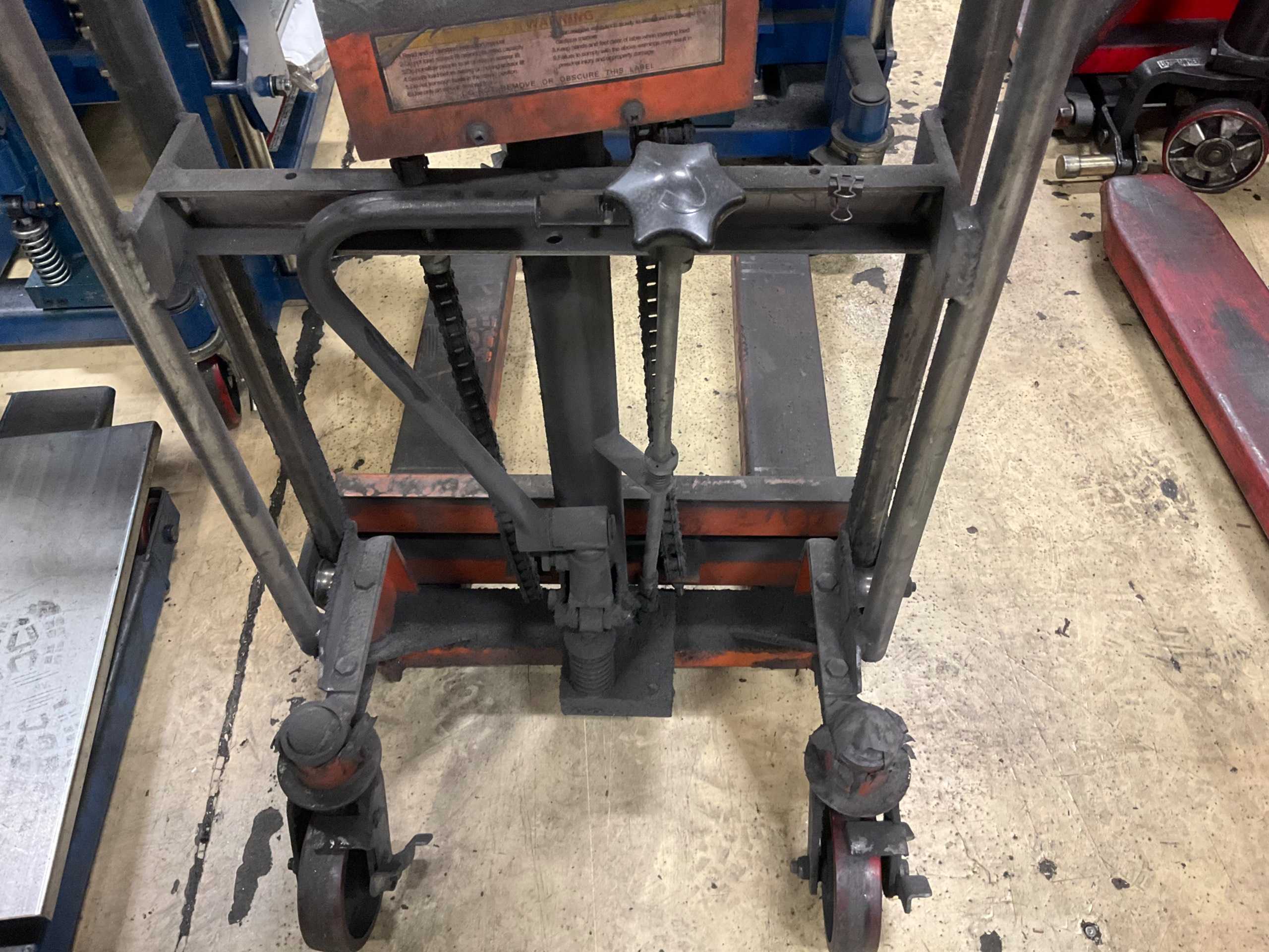 HYDRAULIC STRADDLE STACKER - MATERIAL HANDLING
