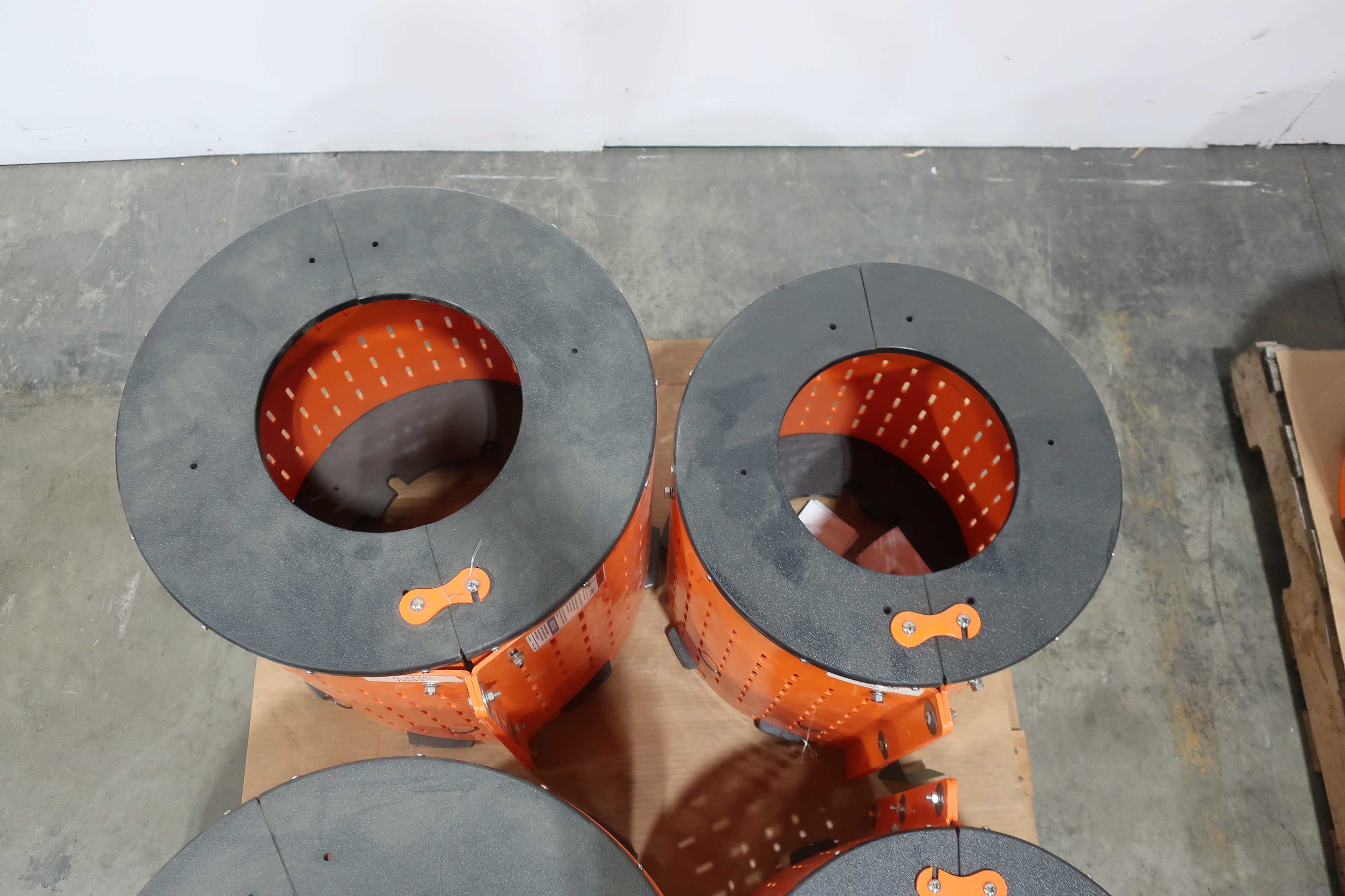 SKU 1740679 - 3 PALLETS OF ASSORTED SAFTEY ORANGE UNIGUARD BARREL GUARD ADAPTER PLATES - PUMP REPLACEMENT PARTS