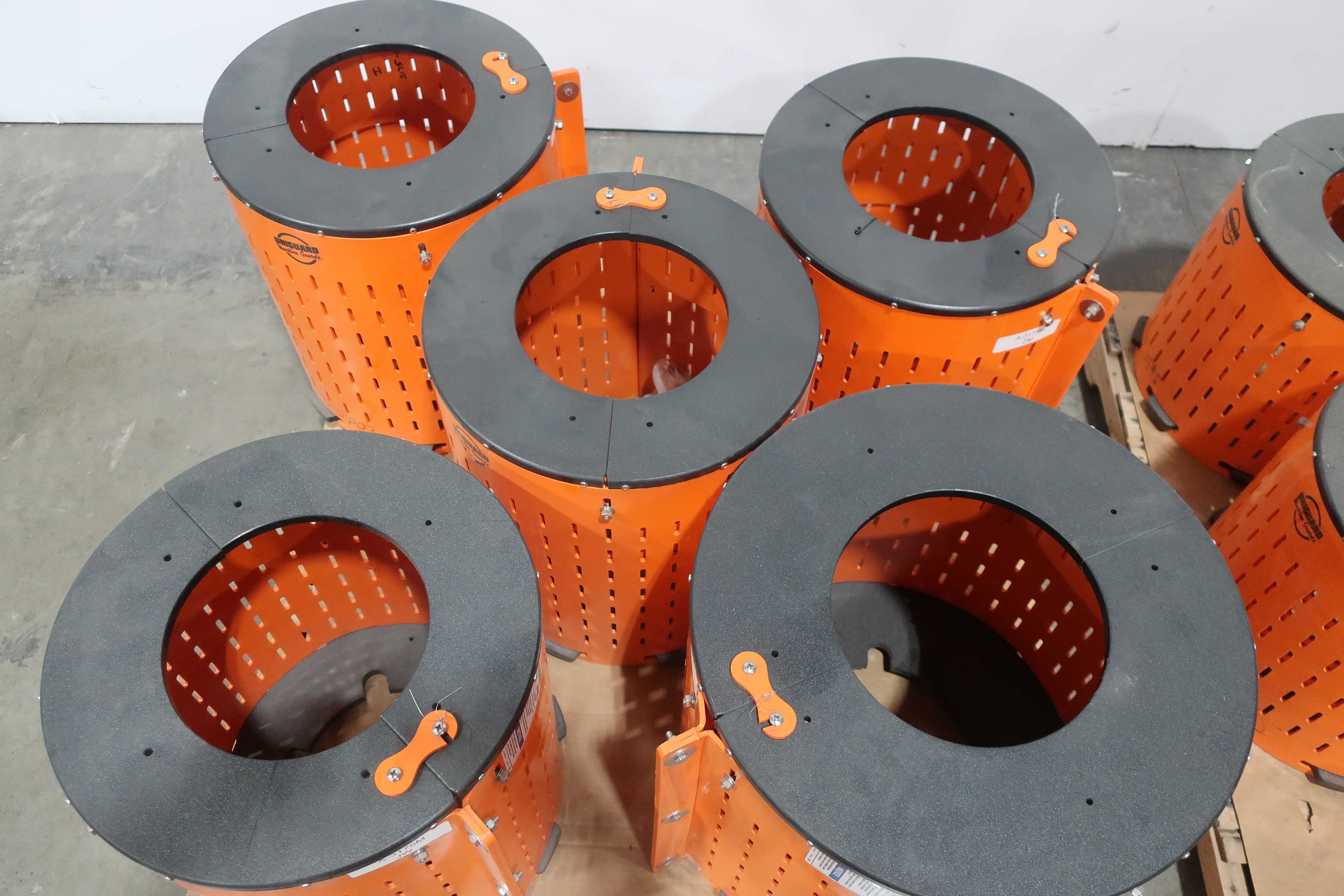 SKU 1740661 - 3 PALLETS OF ASSORTED SAFTEY ORANGE UNIGUARD BARREL GUARD ADAPTER PLATES - PUMP REPLACEMENT PARTS