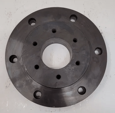 BUCK 10" CHUCK BACK PLATE - OVERALL DIAMETER: 10", THROUGH HOLE: 2-7/8", HUB OD: 6-3/8" - MACHINE TOOLING